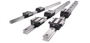 An image of three linear guide (profile rail) bearings